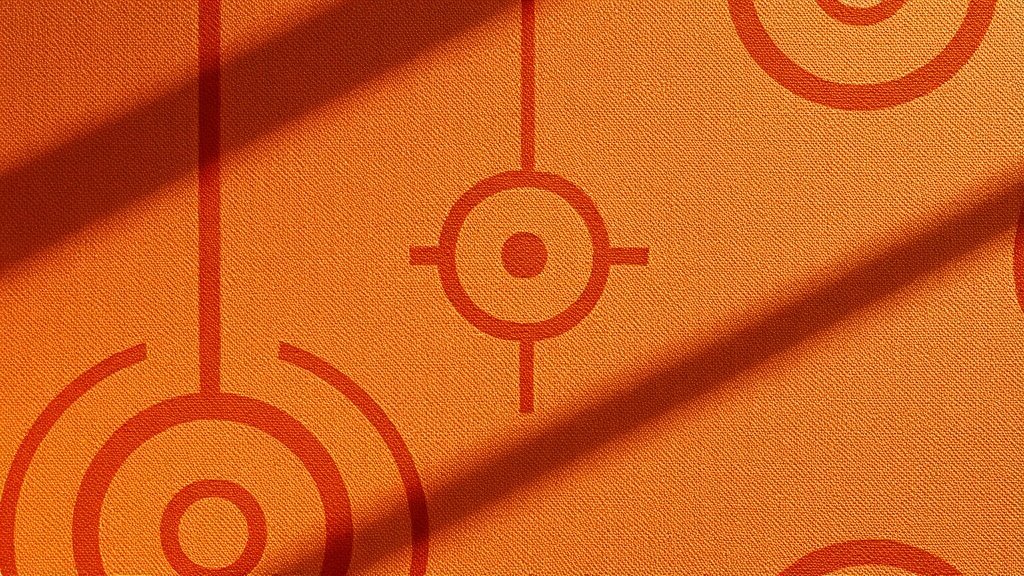 Détail d'une tapisserie terracotta avec motifs graphiques